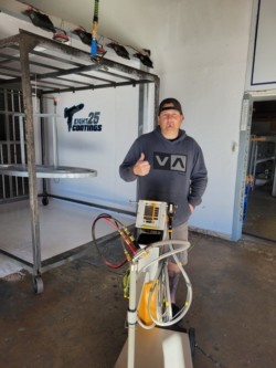 825 Coatings powder coats various materials with high quality finishing equipment. Featured here is the owner of 825 Coatings, Jason Burt, with our new Gema Optiflex Pro B.